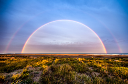 double rainbow in Delta del Ebro in the beach. Spain