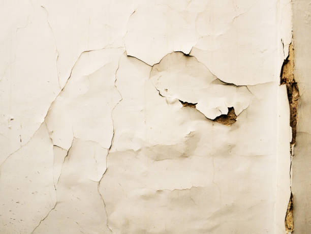 istock The wall of the old house. Cracks on the surface. Background 962533468