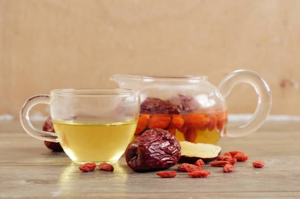istock Jujube, Chinese dried red date fruit on wood 962535776