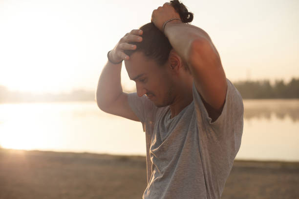 istock Handsome man resting after workout in the park 962538284
