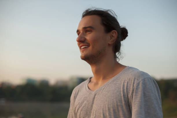 istock Handsome man smiling in the park 962538762