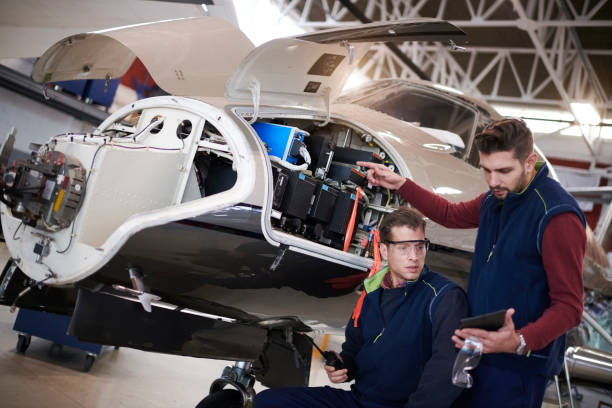 istock Aircraft mechanics in the hangar 962538938