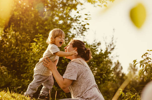 istock Mother With Son Playing Outdoors 962539664