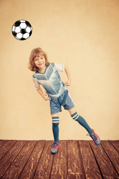 istock Child is pretending to be a soccer player 962543178