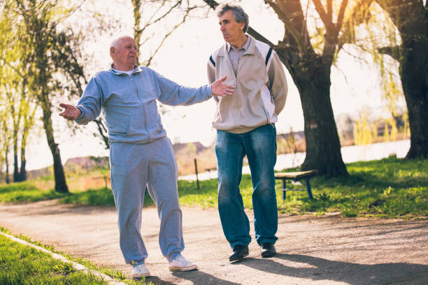 istock Senior men walking in park 962545140