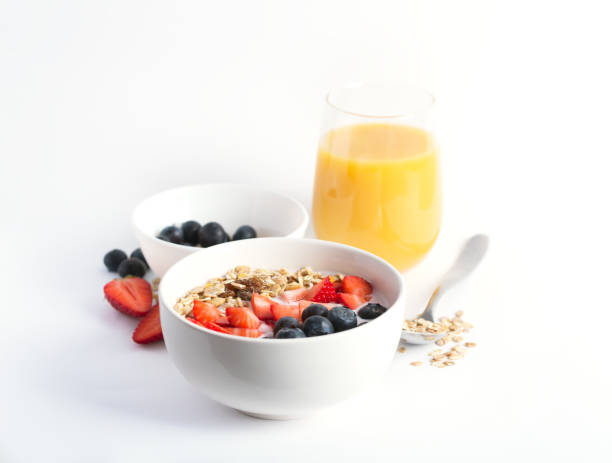 istock Smoothie bowl with yogurt, fresh berries and cereal. Isolated on white background 962545736