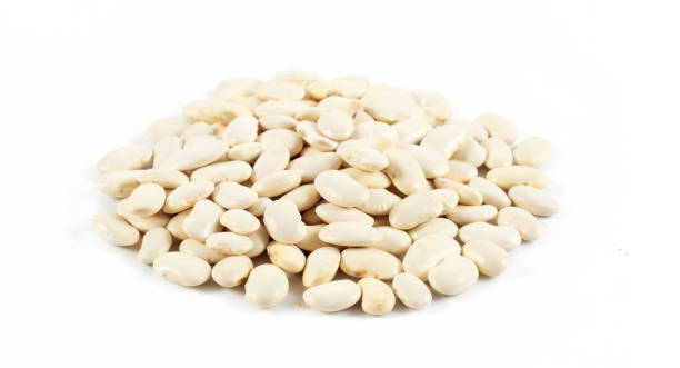 istock Heap of white beans isolated on white background 962553480