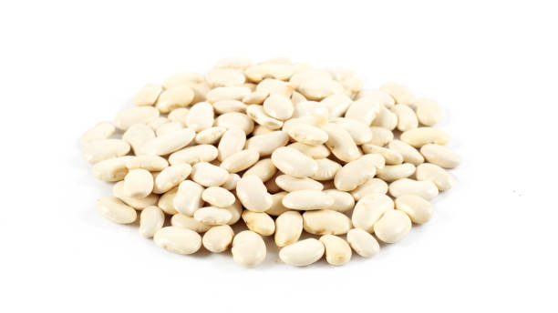 istock Heap of white beans isolated on white background 962553546