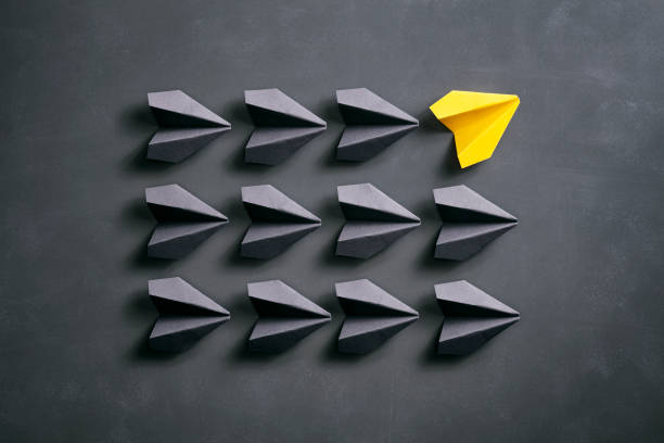 istock Paper airplane on blackboard - Origami Yellow Concept 962557960