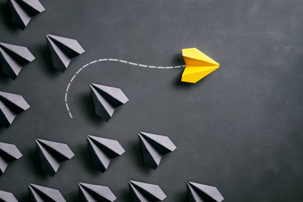 istock Paper airplane on blackboard - Origami Yellow Concept 962558170
