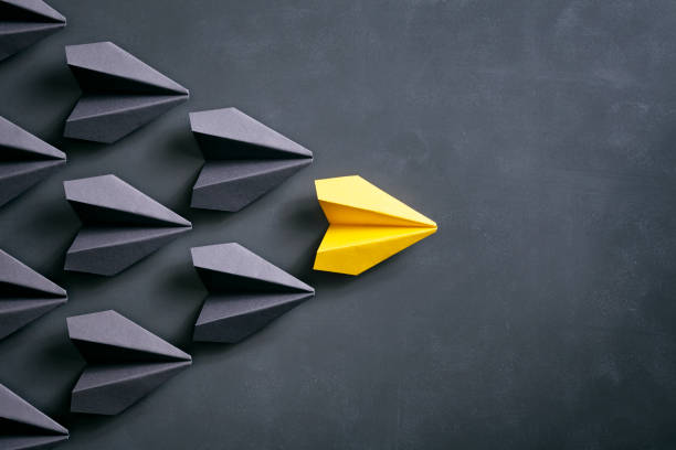 istock Paper airplane on blackboard - Origami Yellow Concept 962558688