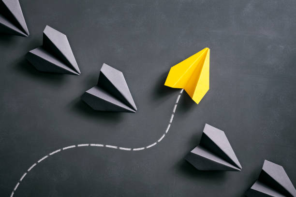 istock Paper airplane on blackboard - Origami Yellow Concept 962558890