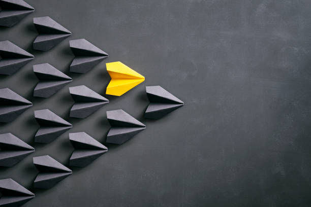 istock Paper airplane on blackboard - Origami Yellow Concept 962559036