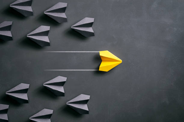 istock Paper airplane on blackboard - Origami Yellow Concept 962559196
