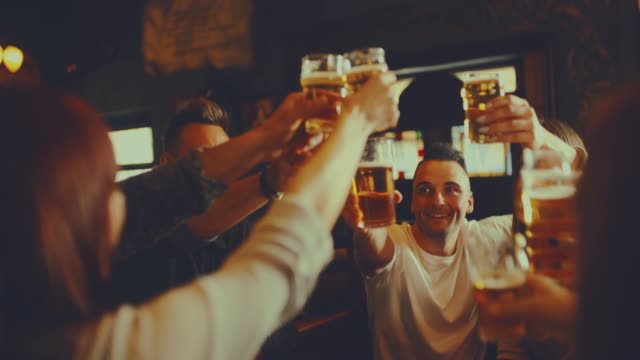 group of friends at the pub. shot in slow motion