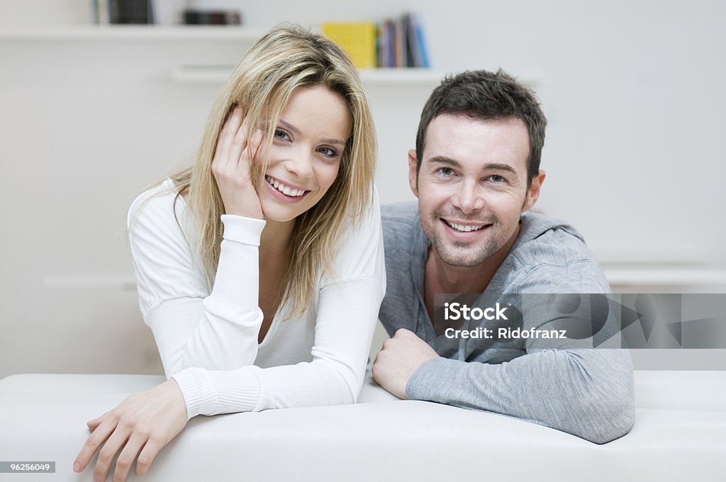 Young smiling couple portrait Young happy couple smiling together at camera in their home. 20-29 Years Stock Photo