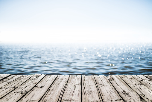 deck de madera junto al mar photo