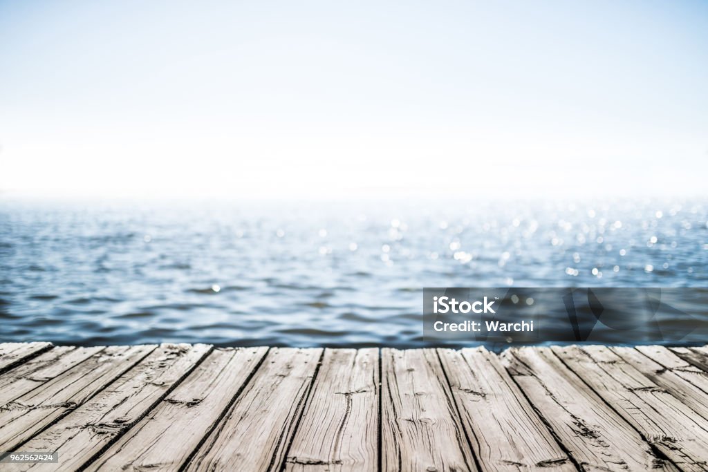 wooden deck by the sea Commercial Dock Stock Photo