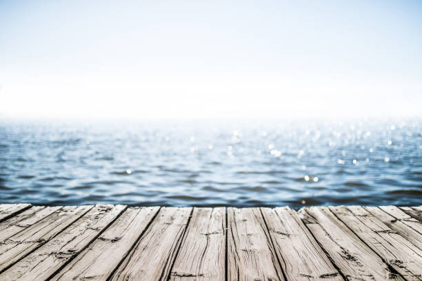 wooden deck by the sea wooden deck by the sea commercial dock stock pictures, royalty-free photos & images