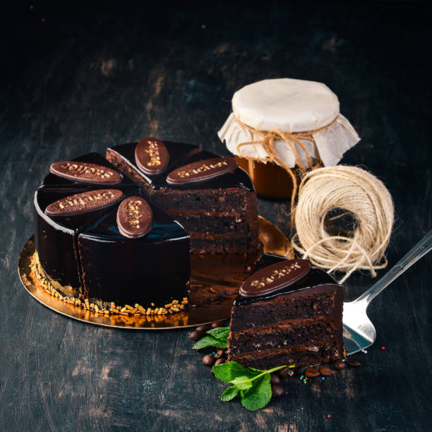 istock Sacher Chocolate Cake. On a wooden background. Top view. Copy space. 962562726