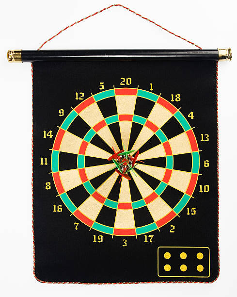Darts set on a black sheet board stock photo