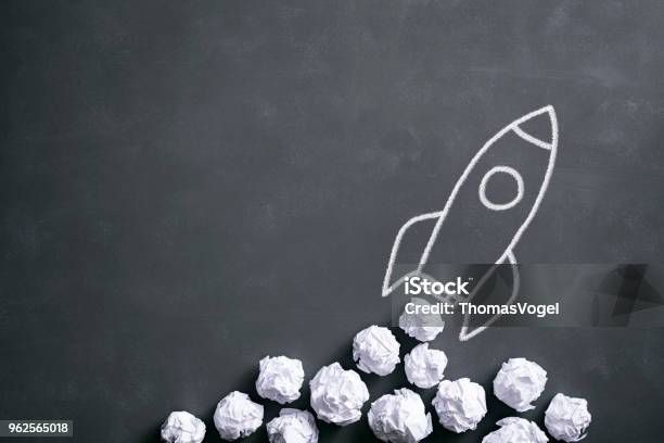 Space Rocket On Blackboard Crumpled Paper Idea Creativity Stock Photo - Download Image Now