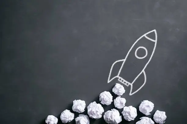 Photo of Space rocket on blackboard - Crumpled paper Idea Creativity