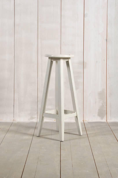 istock Wooden Stool on Wood Background 962569504