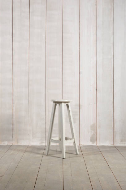 istock Wooden Stool on Wood Background 962569650