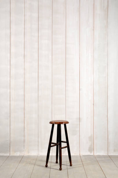 istock Wooden Stool on Wood Background 962569768