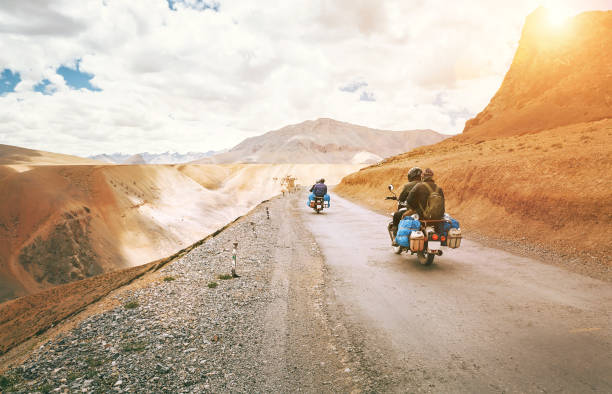 Motorcycle travelers ride in indian Himalaya roads Motorcycle travelers ride in indian Himalaya roads ladakh region stock pictures, royalty-free photos & images