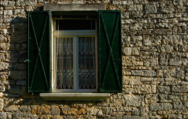 brick wall with old window - mullion windows imagens e fotografias de stock