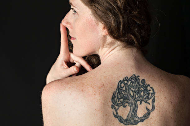 Girl With Tattoo Stock Photo - Download Image Now - Tattoo, Freckle, Neck -  iStock