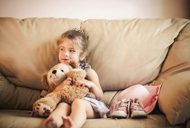 Portrait of Child Girl Hugging Her Soft Toy Bear