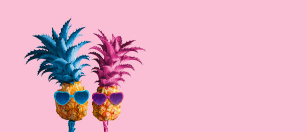 istock Couple pineapples on pink background minimal summer love concept 962577910
