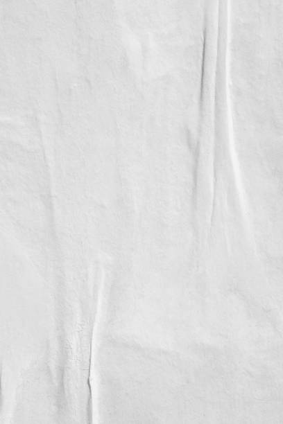 istock Blank old ripped torn paper crumpled creased posters grunge textures backdrop backgrounds 962579416