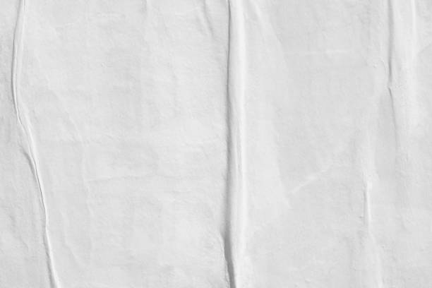 istock Blank old ripped torn paper crumpled creased posters grunge textures backdrop backgrounds 962579942