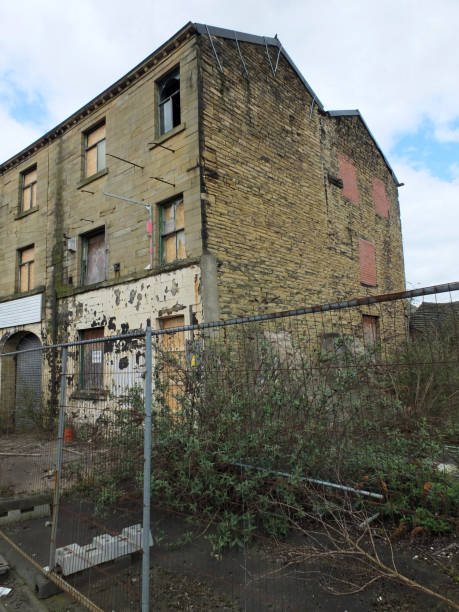 istock derelict abandoned mill in huddersfield england with boarded up and broken windows 962580818