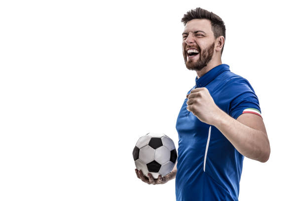 男性アスリート/ホワイト バック グラウンドに祝っている青い制服を着たファン - サッカー選手 ストックフォトと画像