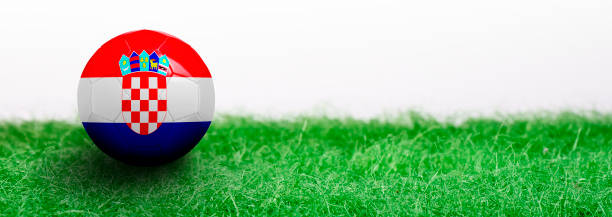istock Panoramic Green grass isolated on white background and flagged soccer ball 962581368