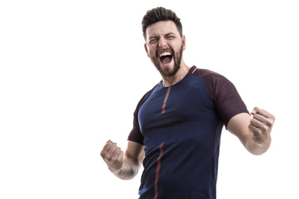 istock Male athlete / fan in blue uniform celebrating on white background 962585110