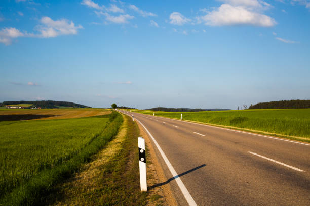 istock Country road in the Upper Palatinate, blue sky 962588292