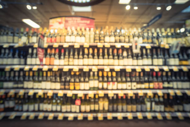istock Vintage blurred wine shelves with price tags at store in USA 962588310