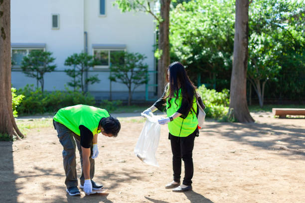 istock People cleaning public park in Tokyo 962589776