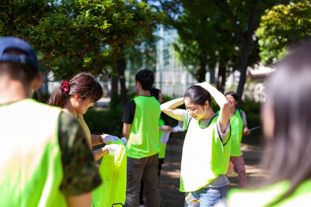 Group of volunteers getting ready to clean up pubic park