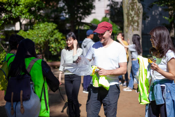 istock Group of volunteers getting ready to clean up pubic park 962589910