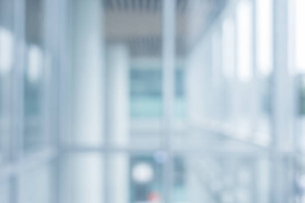 Blurred abstract  grey glass wall building background.
