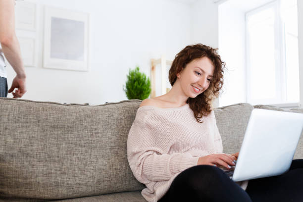 istock Happy female copywriter writes ideas on laptop, uses computer for creating new article in fashion magazine. Young journalist surfes internet,recieves email or message from creative editor. People, technology and career concept 962599204