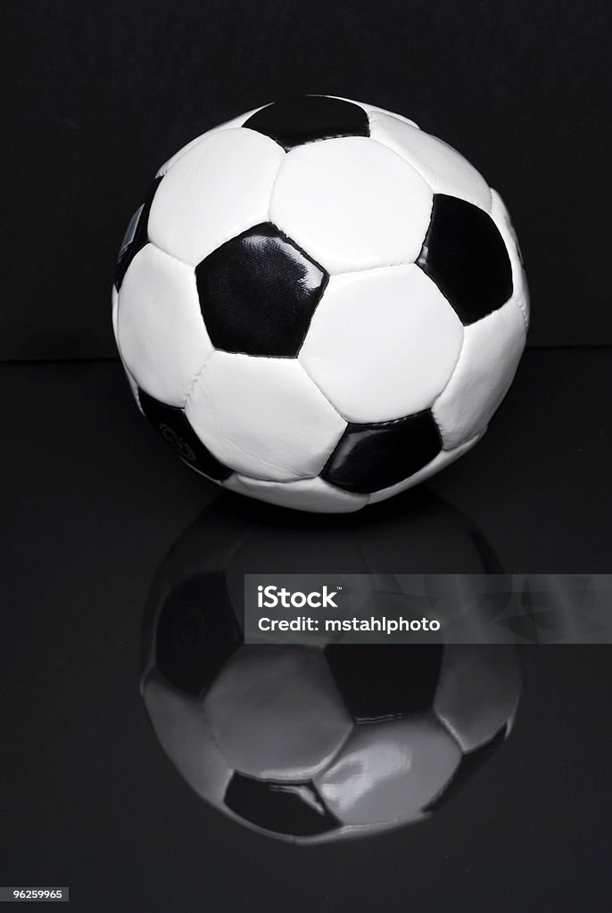 Pallone da calcio su nero - Foto stock royalty-free di Calcio - Sport