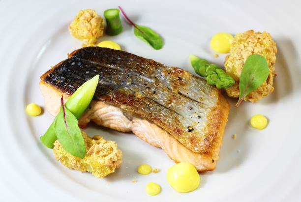 istock Pan seared salmon fillet steak on a white plate 962599836